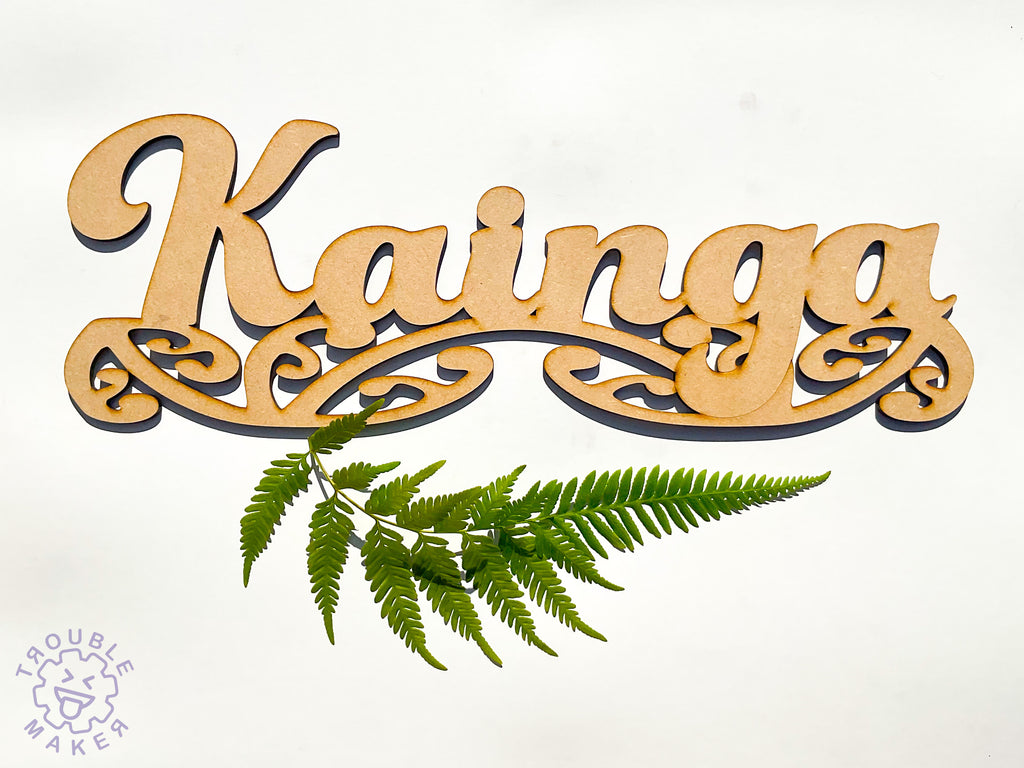 Kainga sign art, carved of wood - TroubleMaker.co.nz