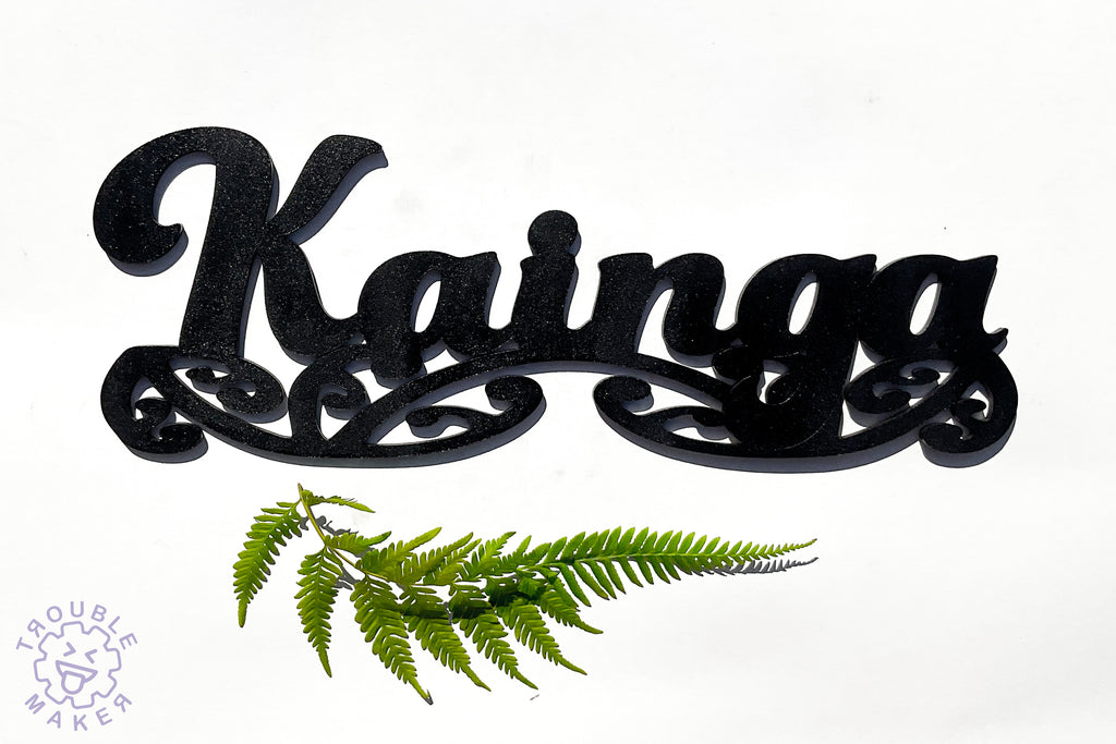 Kainga sign art, carved of wood - TroubleMaker.co.nz