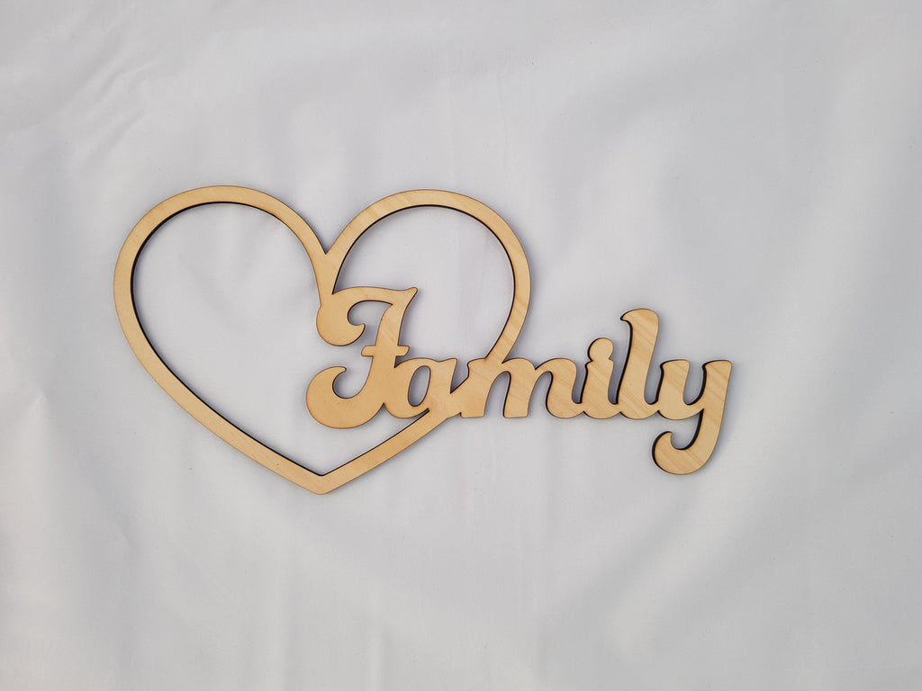 Family in love heart, carved of wood - TroubleMaker.co.nz