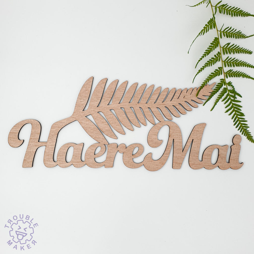 Haere Mai silver fern art, carved of wood - TroubleMaker.co.nz